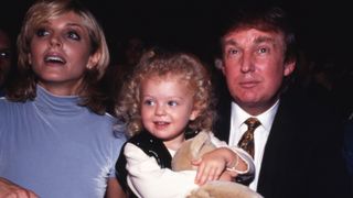 Tiffany Trump with her parents, Marla Maples and Donald Trump, in 1995