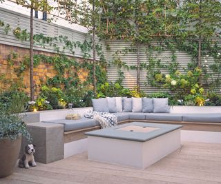 Terrace with large L-shaped sectional and firepit
