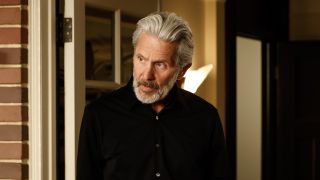 Alden Parker looking over at one of his NCIS colleagues in his apartment