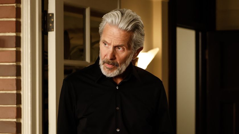 Alden Parker looking over at one of his NCIS colleagues in his apartment