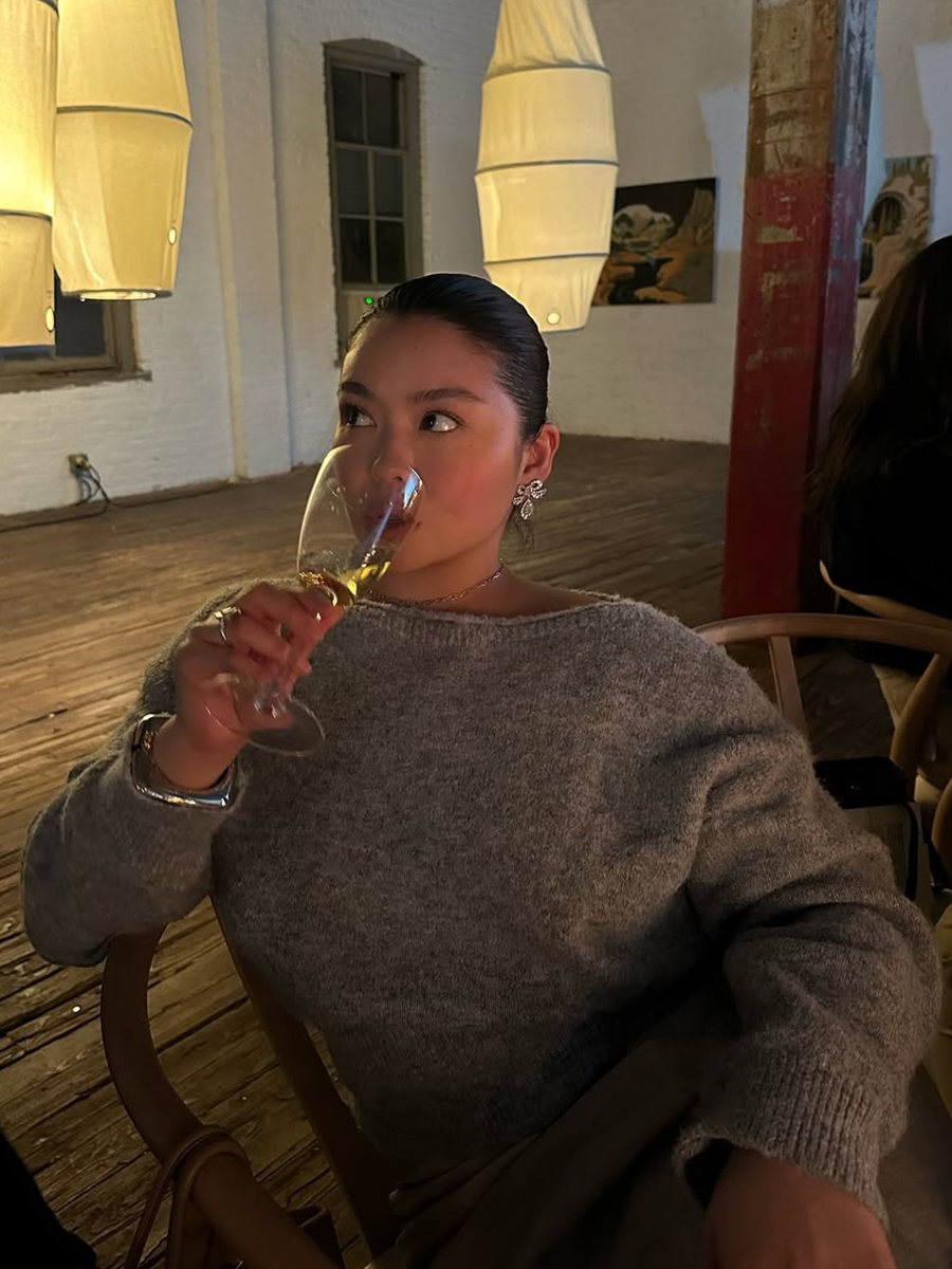 Allison Ho with a sleek updo and flushed cheeks