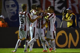 River Plate (Uruguay) players celebrate a goal against Universidad de Chile in the Copa Libertadores in February 2016.