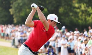 Viktor Hovland at the top of his back swing