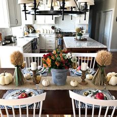 Country kitchen diner with wrought iron chandelier