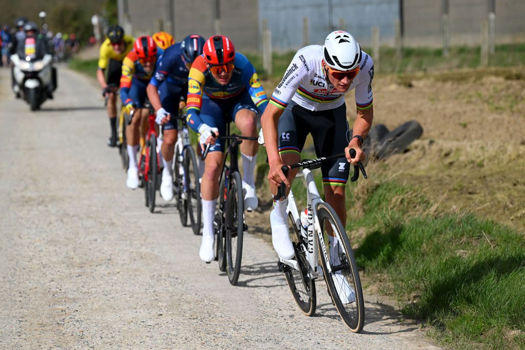 WEVELGEM BELGIUM MARCH 24 LR Mathieu van der Poel of The Netherlands and Team Alpecin Deceuninck Mads Pedersen of Denmark and Team Lidl Trek and Laurence Pithie of New Zealand and Team Groupama FDJ compete in the breakaway passing through the Plugstreets during the 86th GentWevelgem in Flanders Fields 2024 Mens Elite a 2531km one day race from Ieper to Wevelgem UCIWT on March 24 2024 in Wevelgem Belgium Photo by Tim de WaeleGetty Images