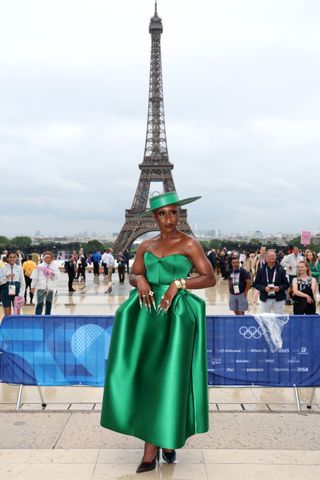 Cynthia Erivo attends the 2024 Olympics opening ceremony wearing a green dress and matching hat