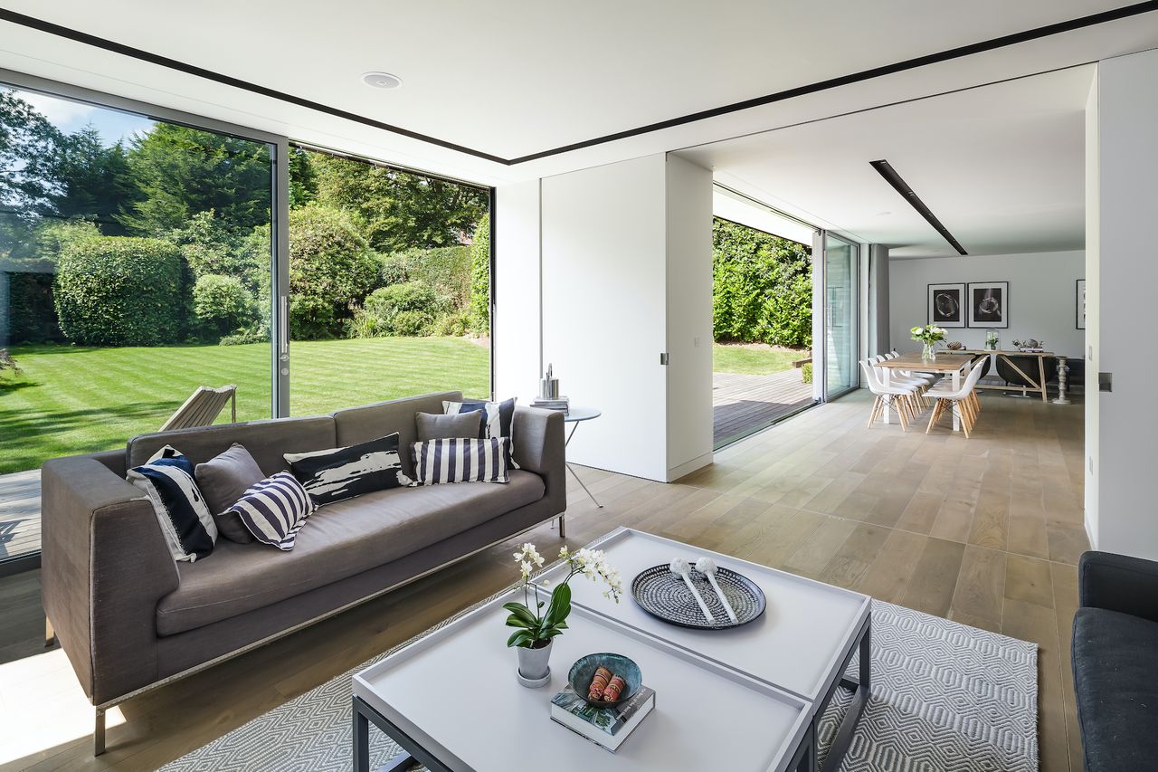 living room with pocket doors in open plan space