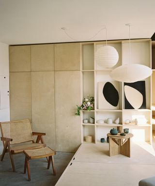 Hanging white lamps, wooden cupboards