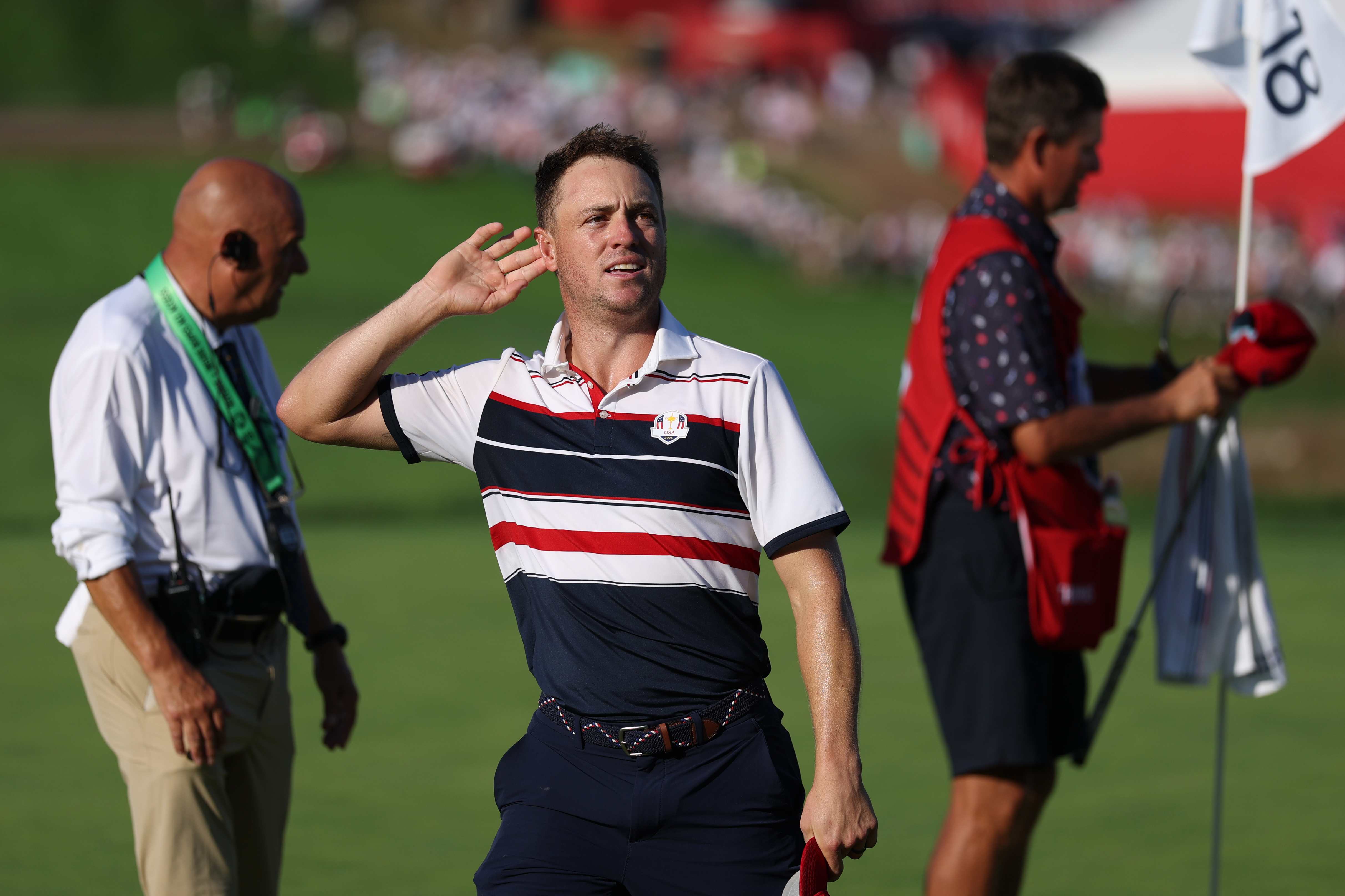Justin Thomas cups his ear at the Ryder Cup