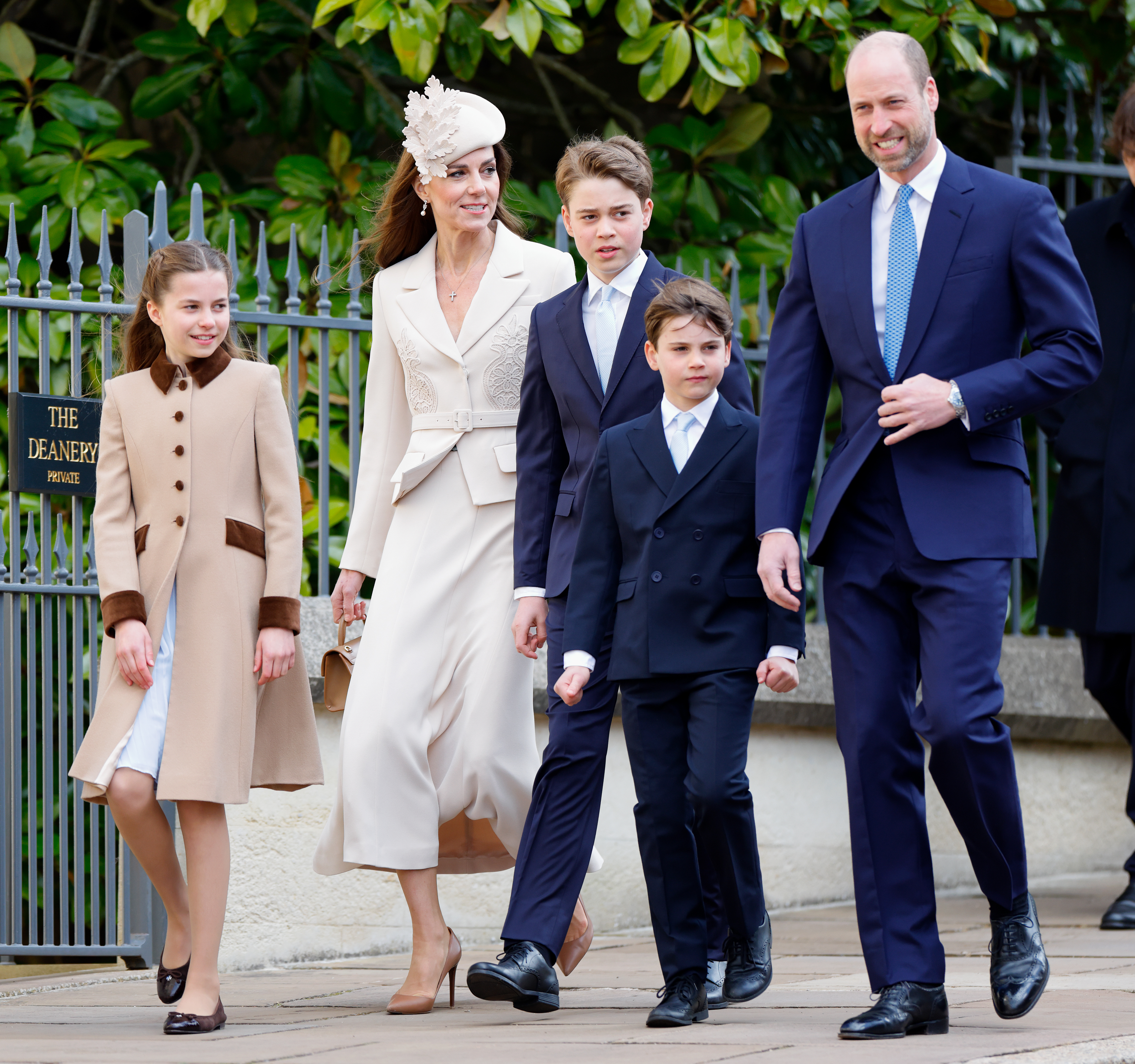Princess Charlotte walking next to Princess Kate, Prince George, Prince Louis and Prince WIlliam