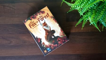 Fox in the Forest box on a wooden table