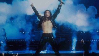 Mark Wahlberg performing onstage in character in the movie Rock Star