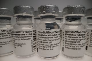 Vials of Pfizer-BioNTech COVID-19 vaccine lined up.