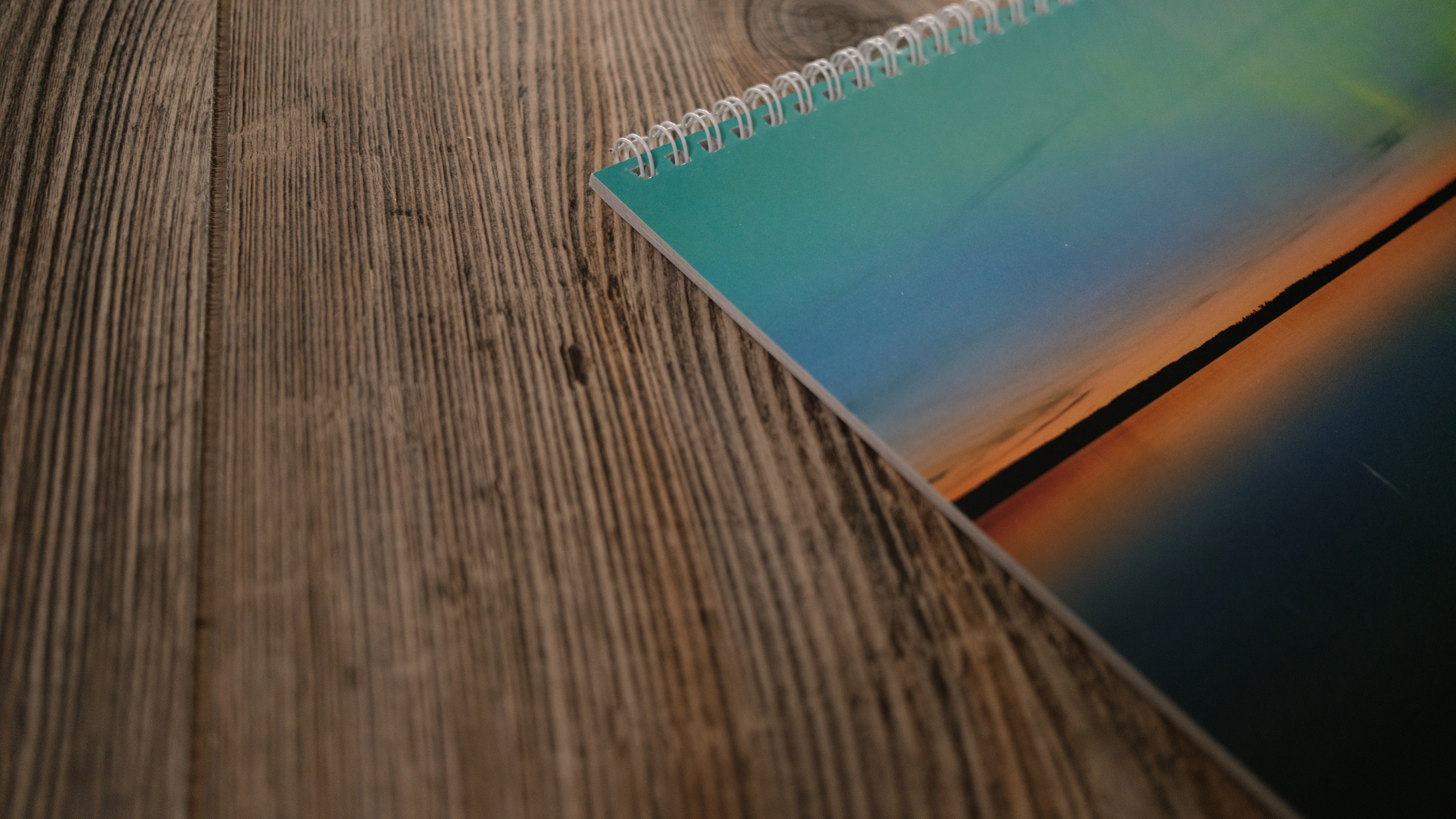 A photo calendar from Vistaprint on a wood background