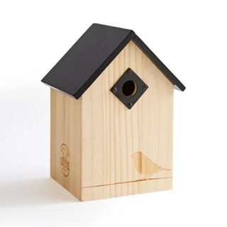 wooden bird house with black roof 