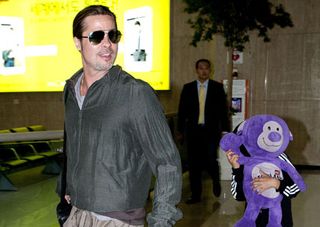 Brad Pitt and son Pax at Gimpo Airport in Seoul