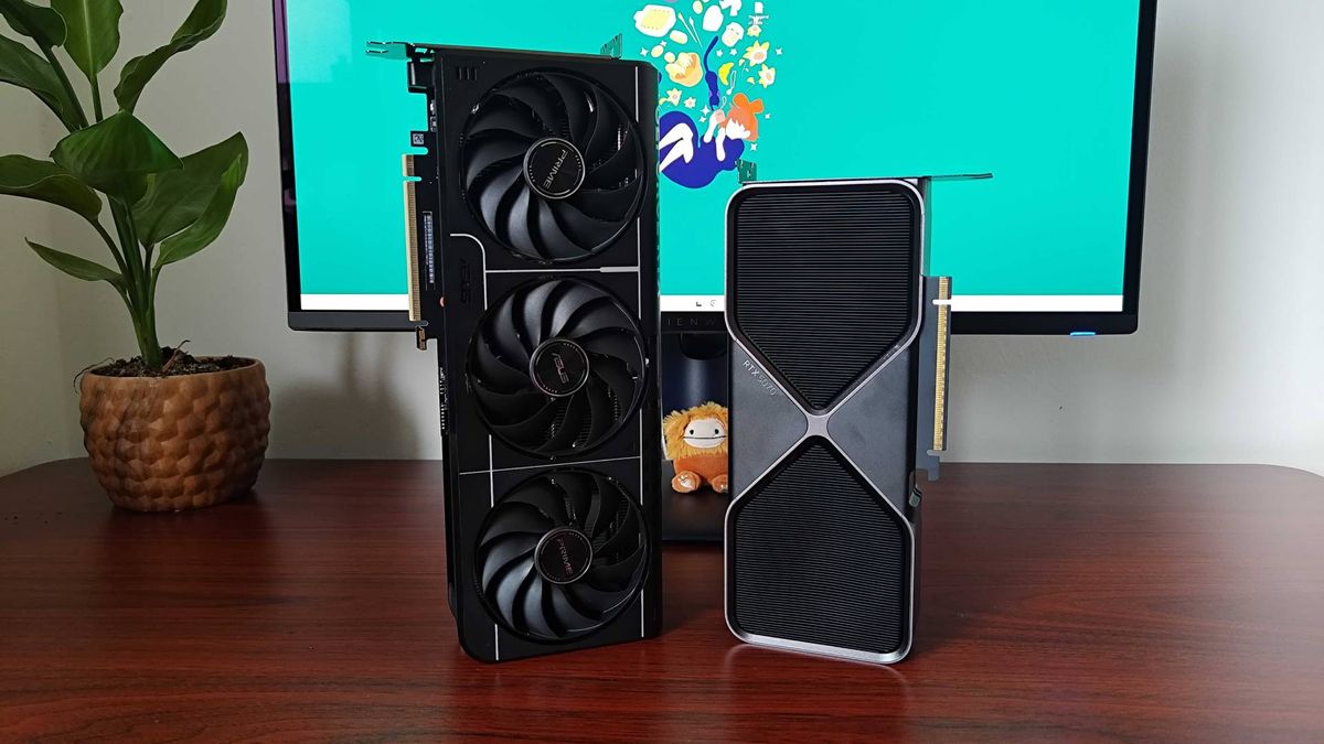 RTX 5070 Founders Edition and Asus Prime OC graphics card standing vertical on woodgrain desk next to plant and monitor