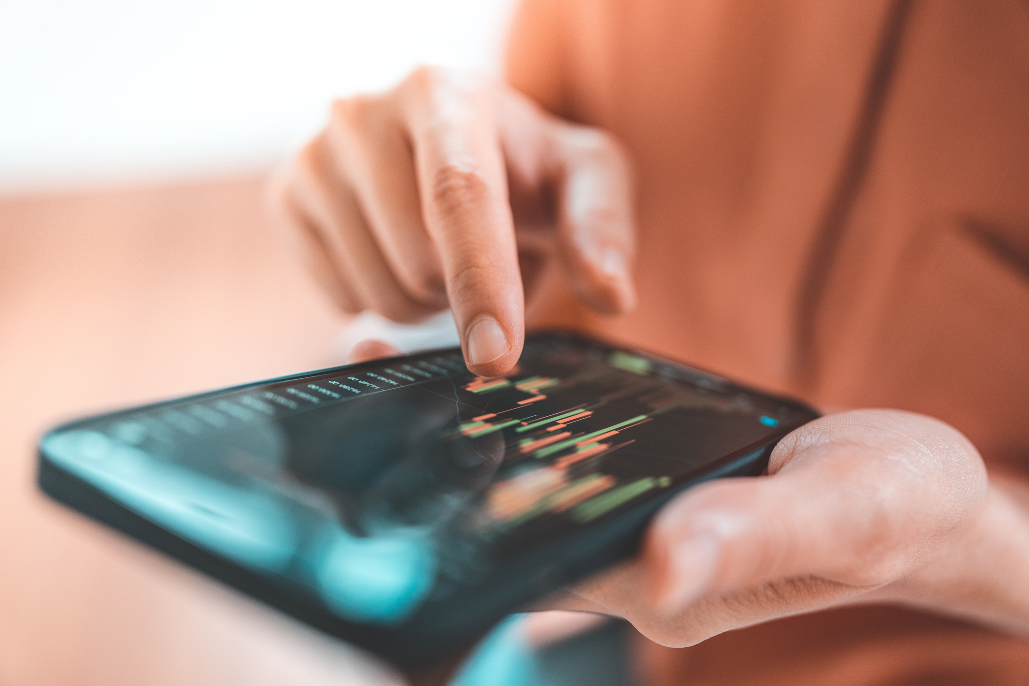 Woman investing in funds on a smartphone app