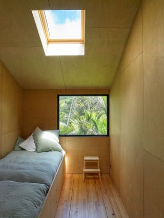 New Zealand convert beach hut small bedroom