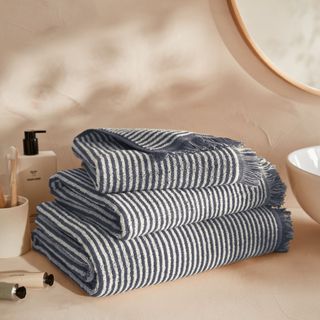 black and white stripey bath towels on bathroom basin area