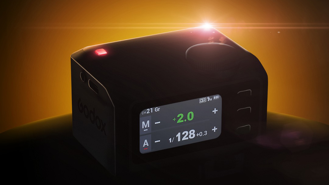 An image of a backlit small, boxy flash with a lit up screen