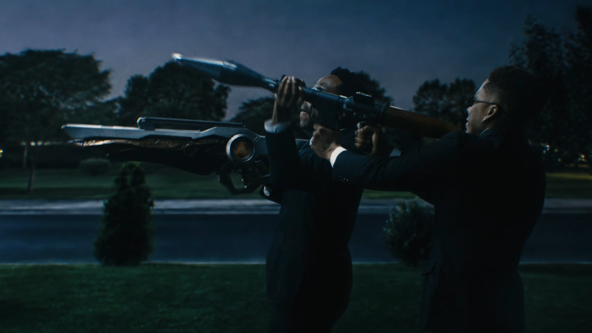 Tyler the Creator and AZ Chike dressed as the Men in Black in the Look Like My Mama music video.