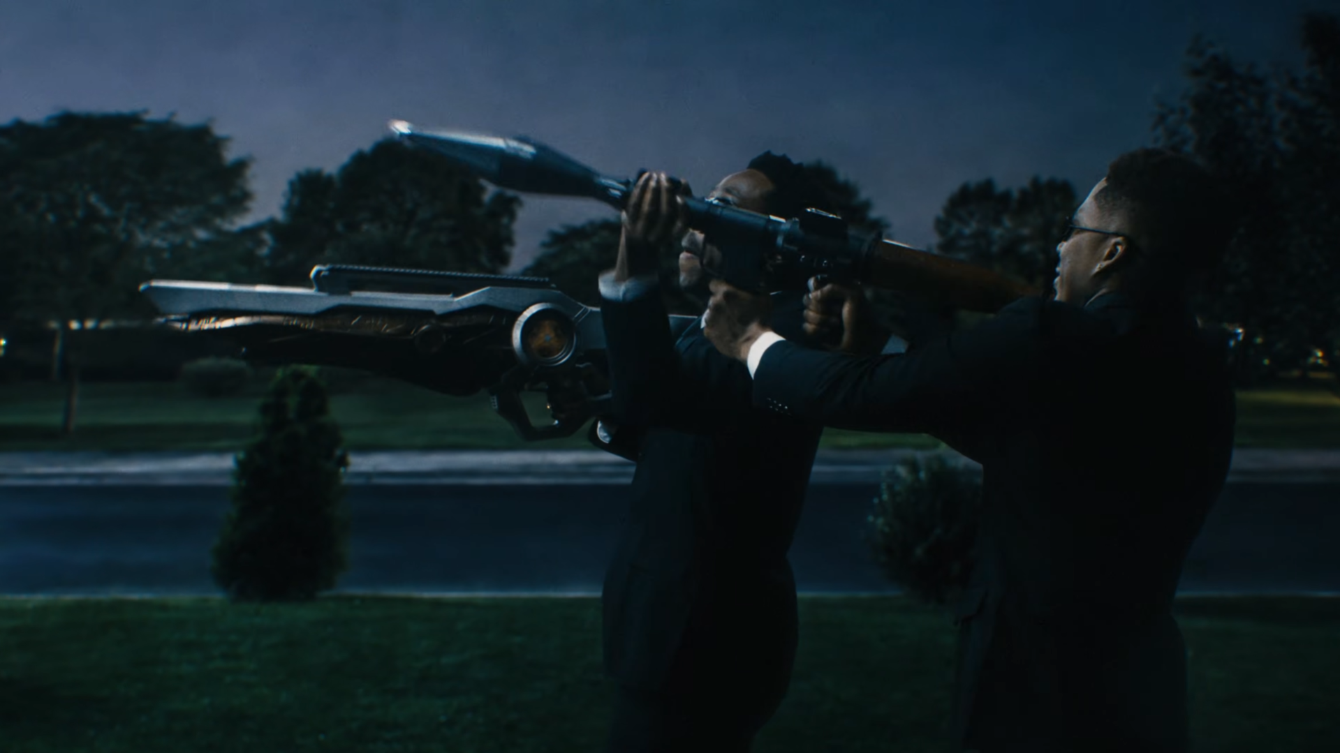 Tyler the Creator and AZ Chike dressed as the Men in Black in the Look Like My Mama music video.