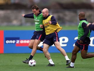 Danny Mills up against Gareth Southgate during an England training session in 2001