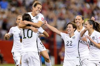U.S. Women's National Soccer Team celebrating on field
