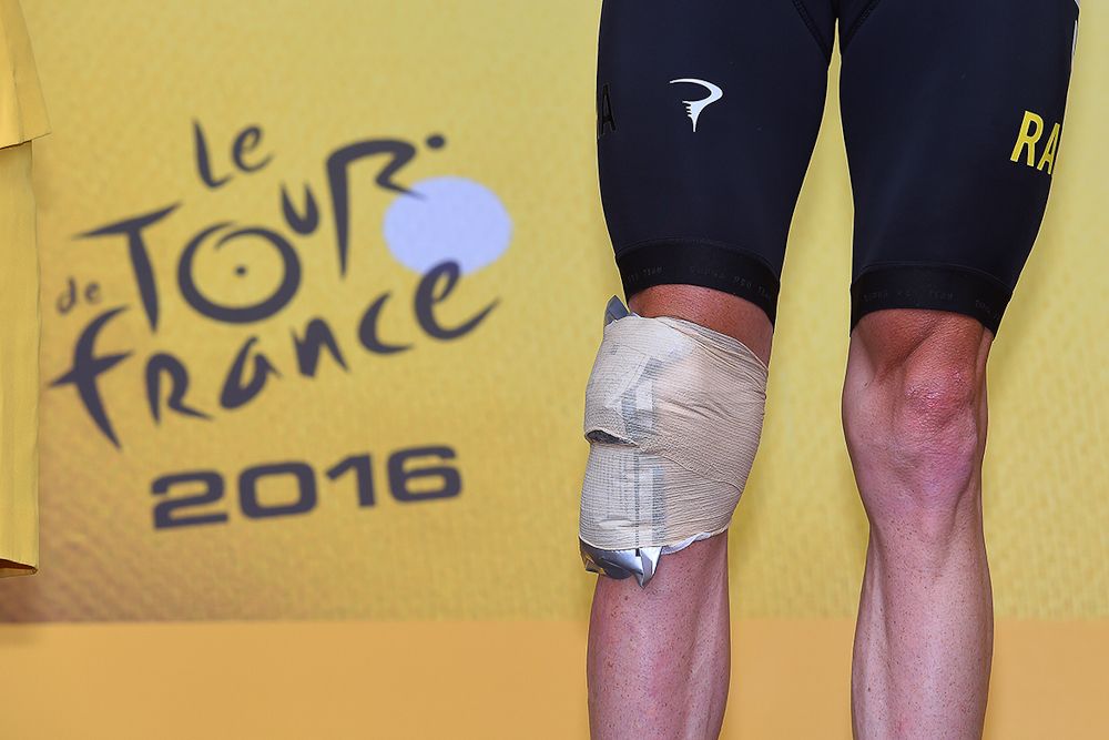 Chris Froome's knee was under wraps on the stage 19 podium