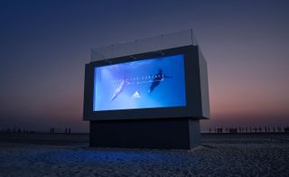 Adidas liquid billboard in Dubai at night