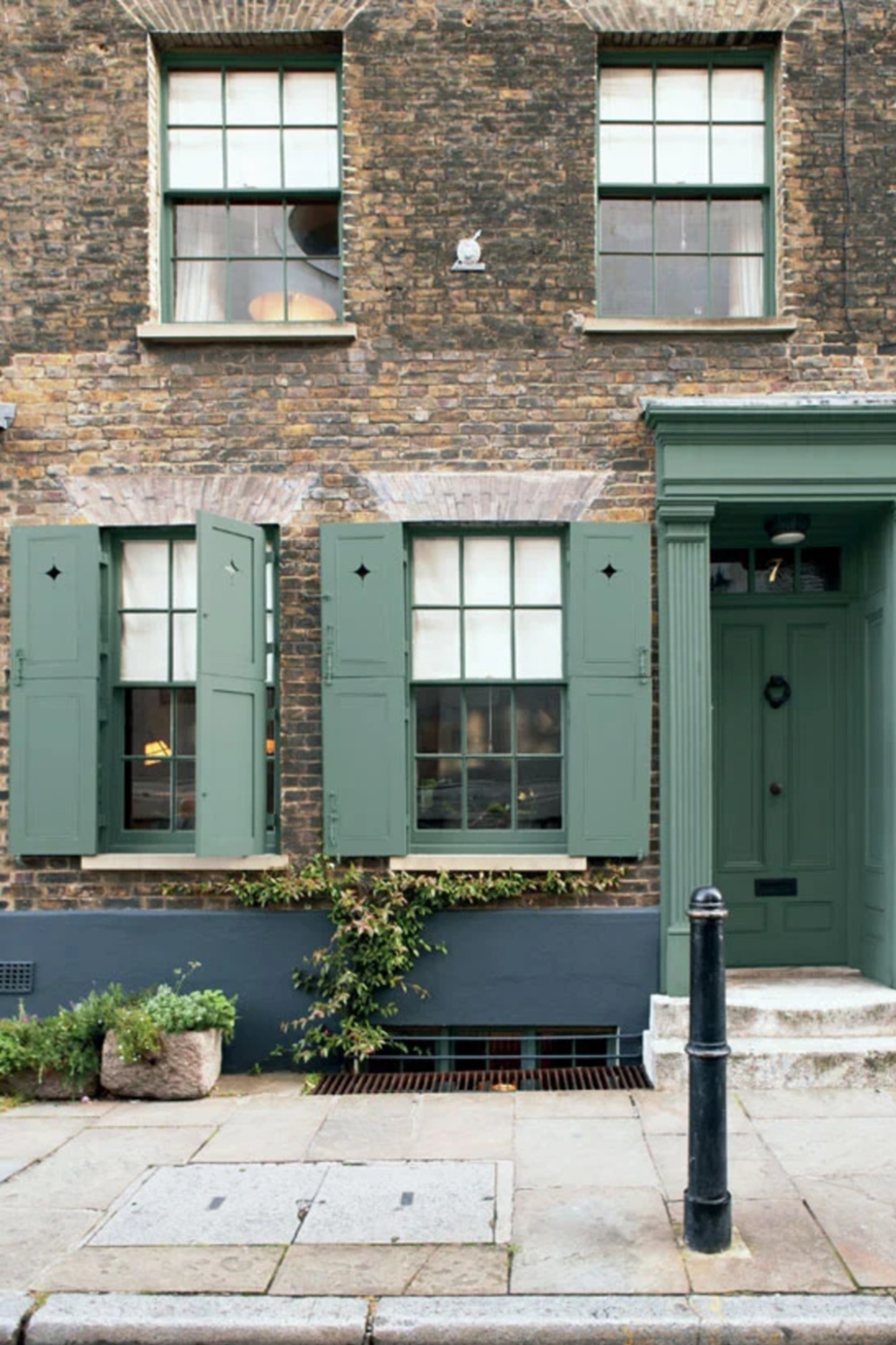 Shutters and doorway painted in Farrow & Ball's Green Smoke