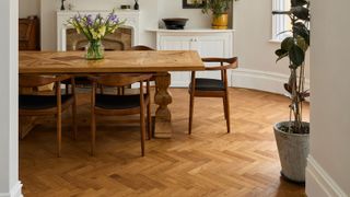 dining room with archway and herringbone engineered timber flooring