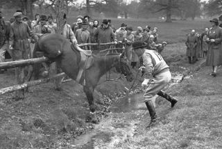 14th May 1949: Colonel CPD Legard's horse Varne slips on the shelving approaching a water jump during trials in Badminton Great Park, in preparation for the 1952 Olympic Games. Photo by Bert Hardy/Picture Post/Getty Images.