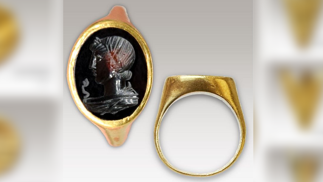 Gold ring with intaglio cameo stone carved with bust of Apollo and a snake