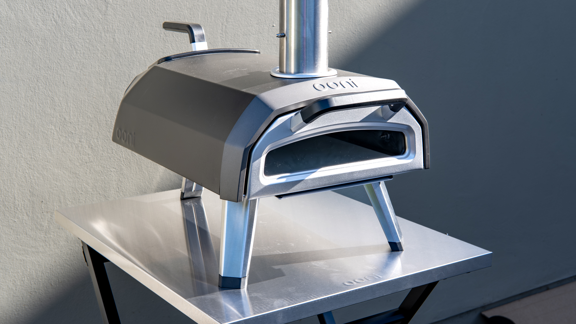 Ooni Karu 2 pizza oven outdoors on a table