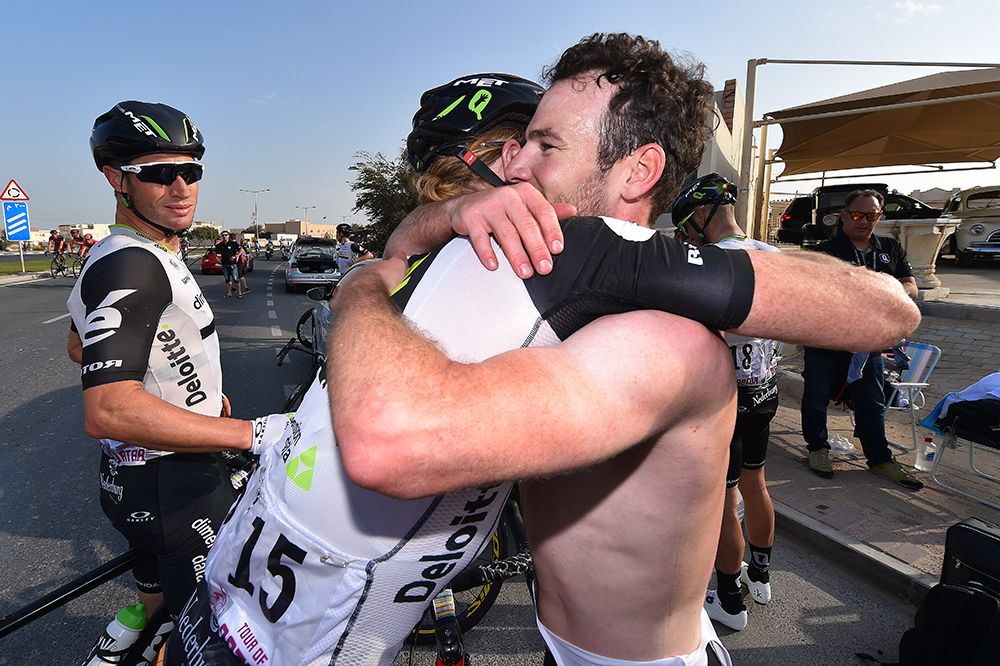 Mark Cavendish and Tyler Farrar hug at the finish of stage 1