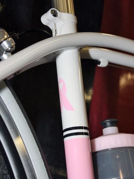 Hill built this bike at least in part as a tribute to breast cancer awareness. The cream-colored frame is highlighted with pink accents, there's the telltale pink ribbon on the back of the seat tube and well as a full complement of pink bits from Chris King.