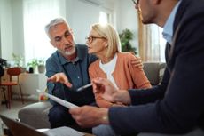 Mature couple talking to a financial advisor 