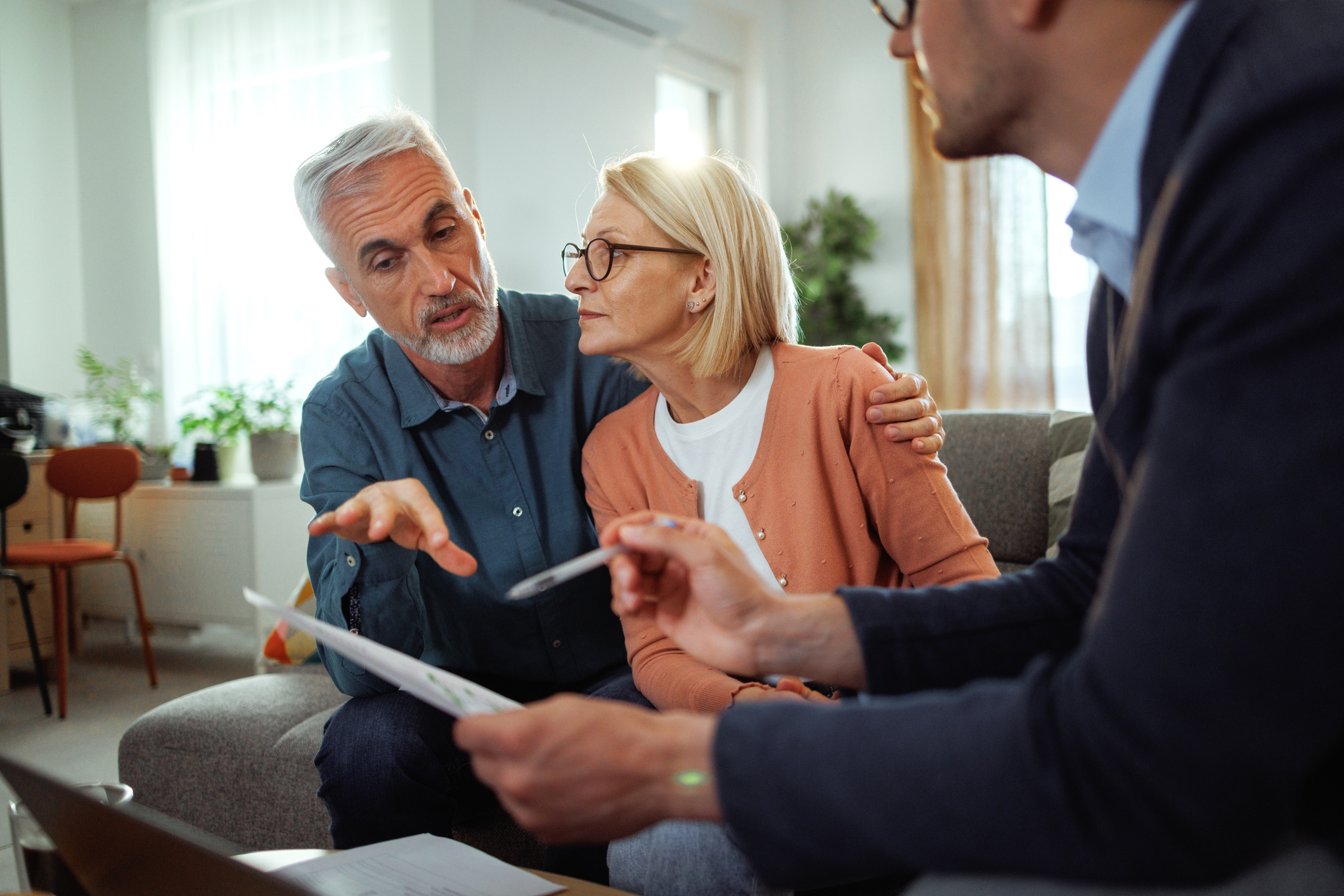 Mature couple talking to a financial advisor 