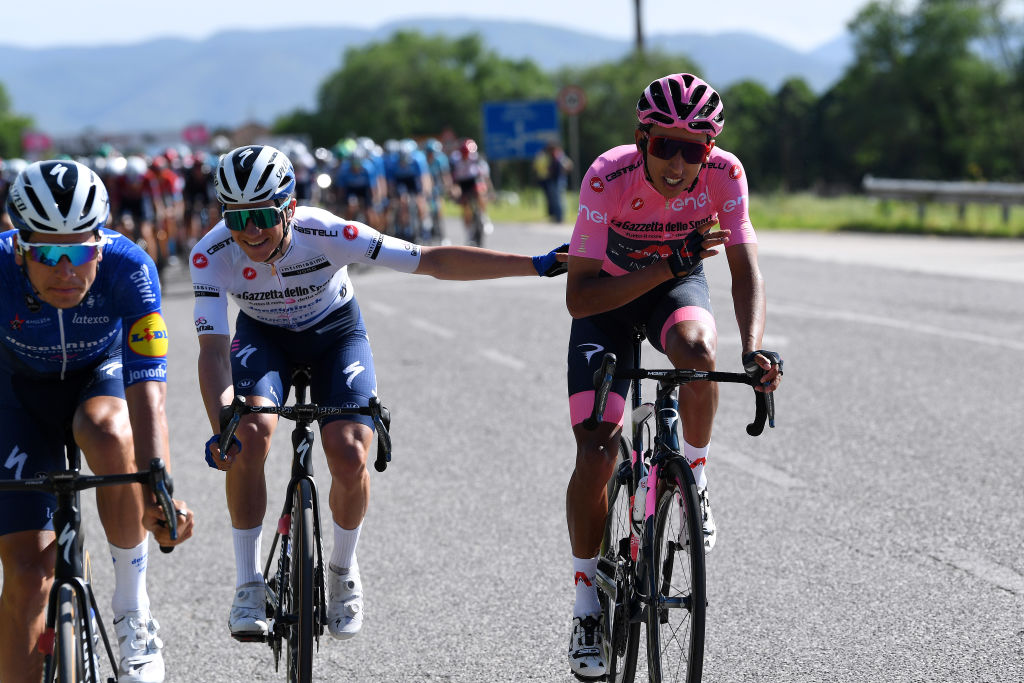 FOLIGNO ITALY MAY 17 Joao Almeida of Portugal and Team Deceuninck QuickStep Remco Evenepoel of Belgium and Team Deceuninck QuickStep white best young jersey Egan Arley Bernal Gomez of Colombia and Team INEOS Grenadiers Pink Leader Jersey during the 104th Giro dItalia 2021 Stage 10 a 139km stage from LAquila to Foligno girodiitalia Giro on May 17 2021 in Foligno Italy Photo by Tim de WaeleGetty Images