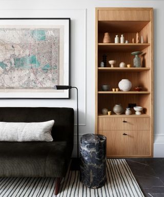 ceramics displayed on alcove shelving in a hallway