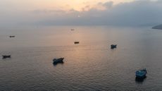 Ships anchored off Oman's northern Musandam Peninsula near the Strait of Hormuz