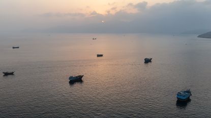 Ships anchored off Oman's northern Musandam Peninsula near the Strait of Hormuz