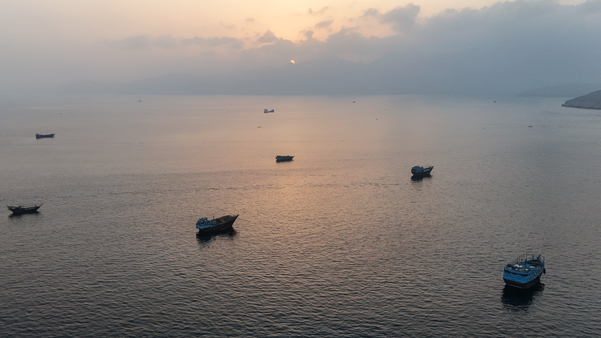 Ships anchored off Oman's northern Musandam Peninsula near the Strait of Hormuz