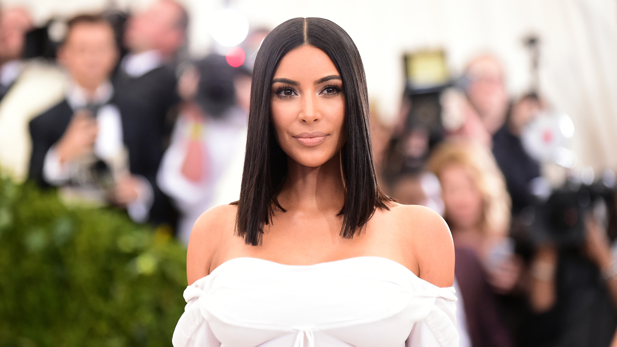 Kim Kardashian Baffles Fans With Louis Vuitton Snake Photo