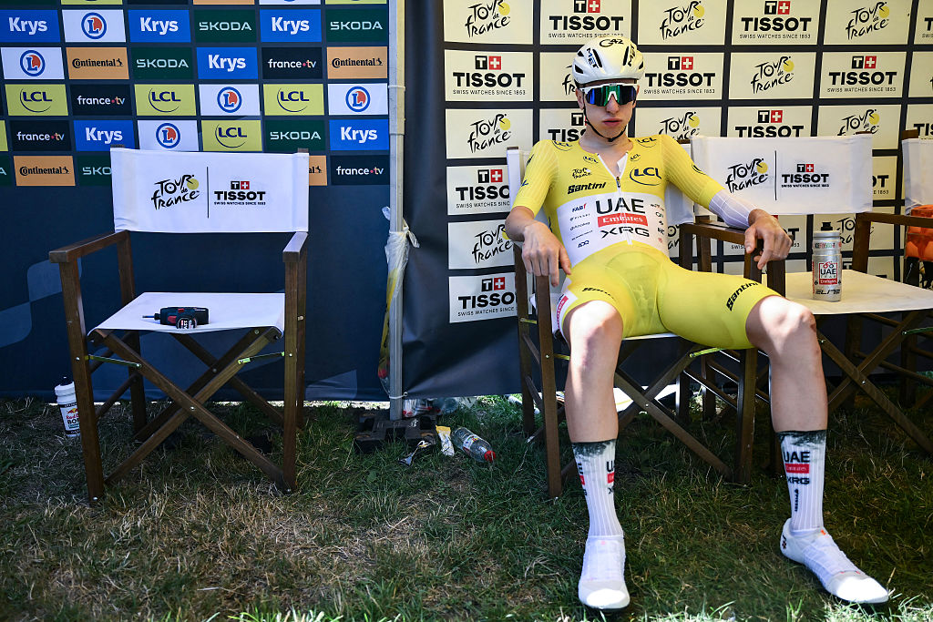 UAE Team Emirates - XRG team&#039;s Slovenian rider Tadej Pogacar wearing the overall leader&#039;s yellow jersey awaits the start of the 13th stage of the 112th edition of the Tour de France cycling race, 10.9 km individual time trial between Loudenvielle and Peyragudes, in the Pyrenees mountains of southwestern France, on July 18, 2025. (Photo by Marco BERTORELLO / AFP)