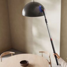 Using the Dyson PencilVac to dust a black lampshade