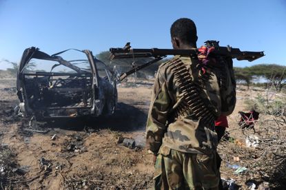 The site of a car bomb in Somalia.