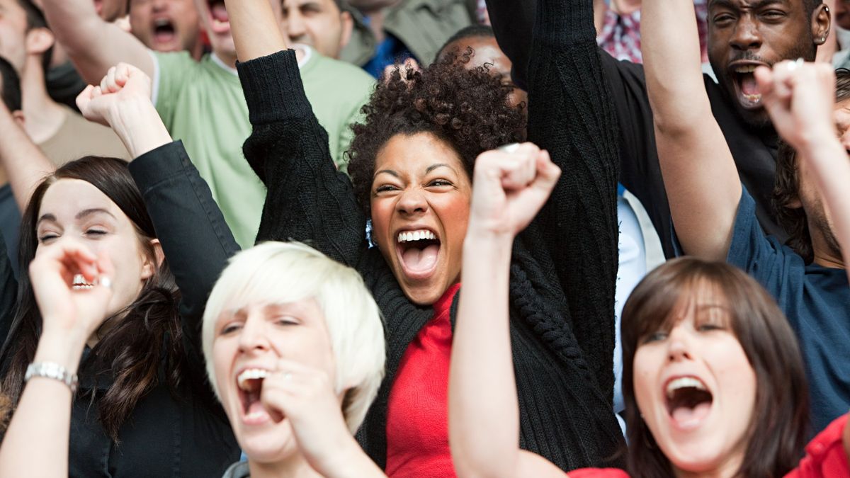 A crowd of people cheering.